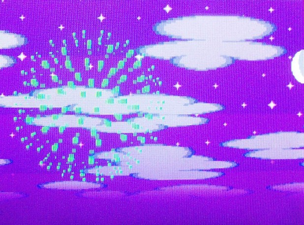 Green firework on a darker sky