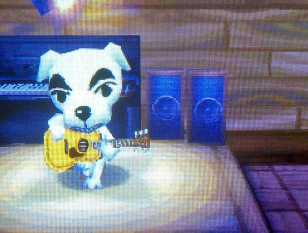 KK Slider singing through a grin