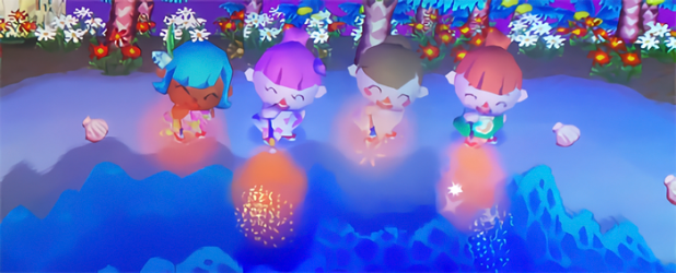 Twisk, Bell, Harmony, and Melody setting off sparklers on the beach