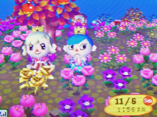 Kammile and I matching the pastel garden with our pastel dresses and crowns