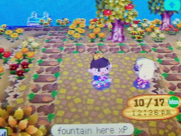 Showing Kammile where I plan to put a fountain on my island